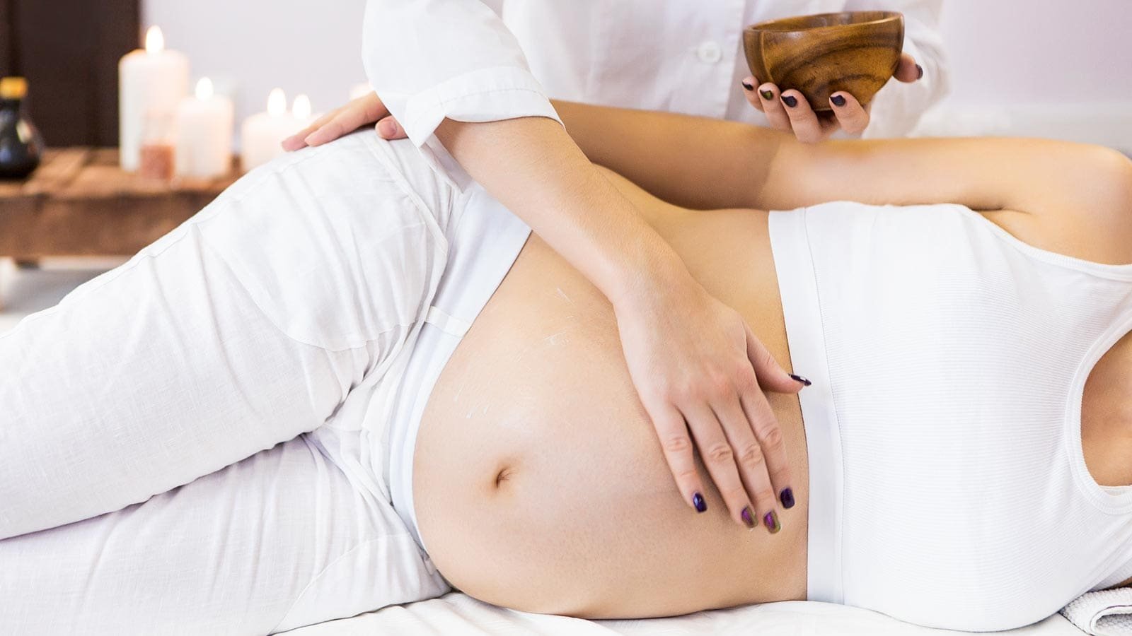 Pregnant woman receiving a prenatal massage