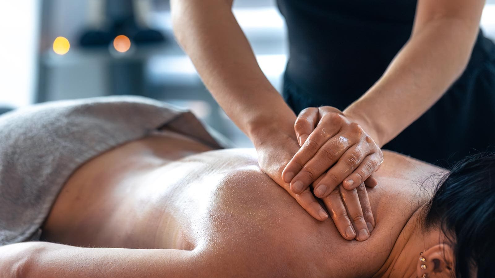Woman receiving RMT massage in Langley